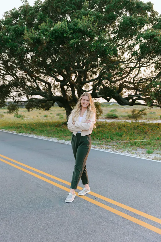 Ali, licensed therapist, standing outdoors in professional attire